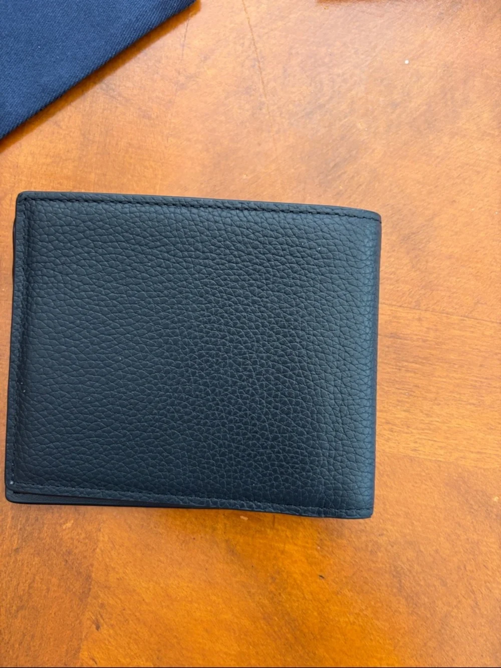 Christian Dior icon bifold wallet. Black grained calfskin